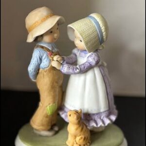 Vintage Holly Hobbie porcelain figurine titled "Love Is The Nicest Gift"